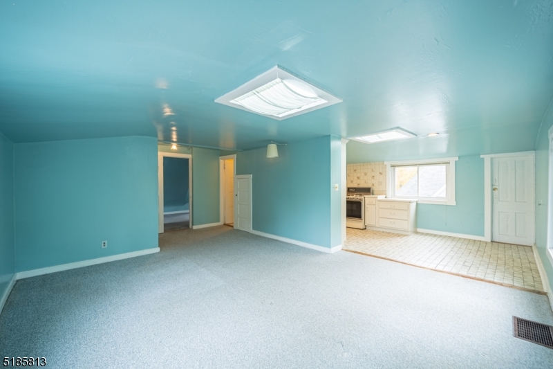 180 Bellevue Avenue Montclair, NJ 07043 - Photo 4 of 13 an empty room with a bathroom and a sink