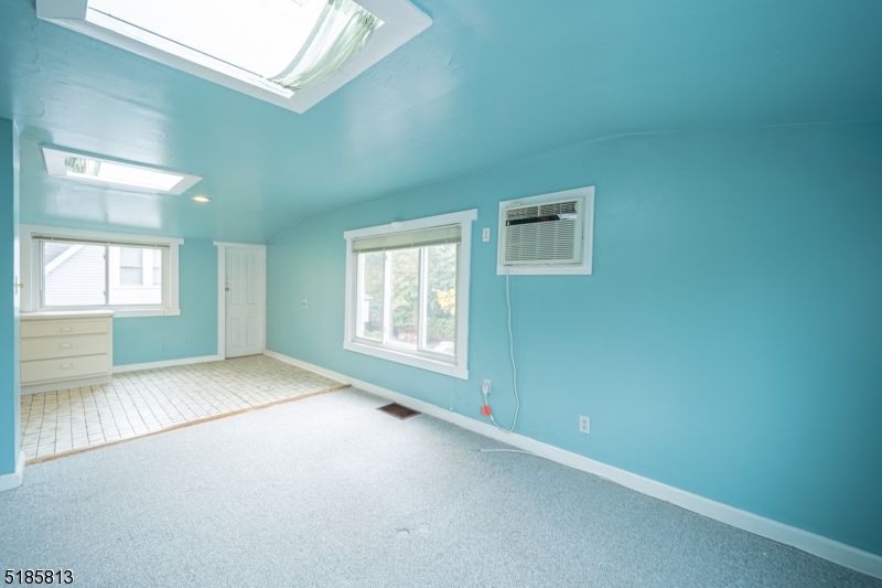 180 Bellevue Avenue Montclair, NJ 07043 - Photo 5 of 13 an empty room with windows
