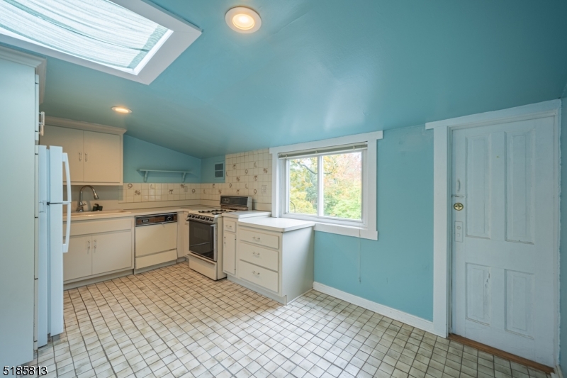 180 Bellevue Avenue Montclair, NJ 07043 - Photo 7 of 13 a kitchen with a sink cabinets and window