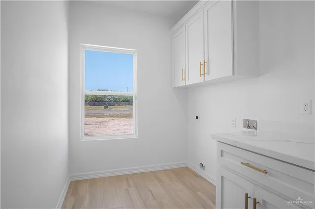 a view of storage and utility room with closet