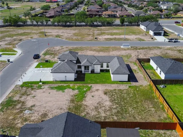 an aerial view of a house with outdoor space