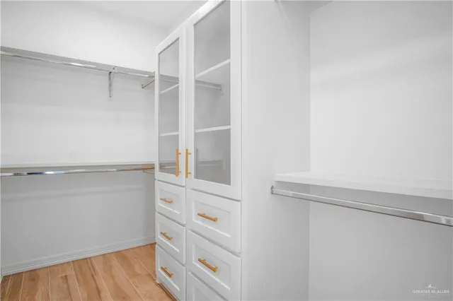 a view of an empty walk in closet