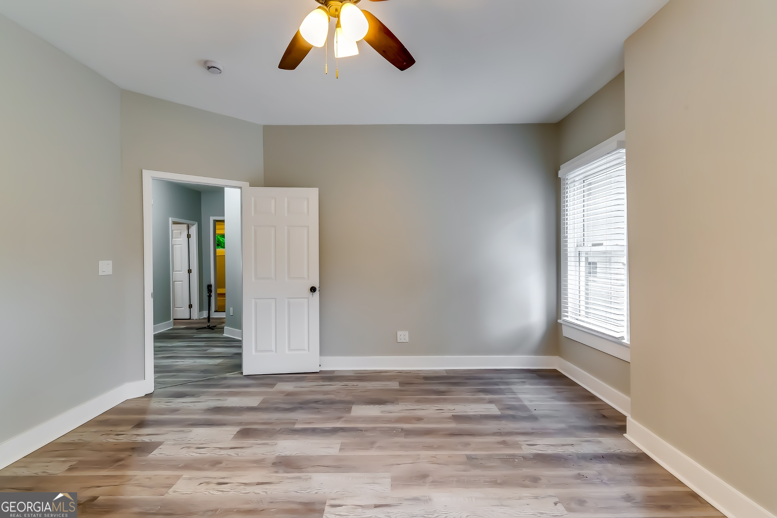 1126 Briarcliff Place Northeast, Unit 2 Atlanta, GA 30306 - Photo 9 of 12 wooden floor in an empty room with a window
