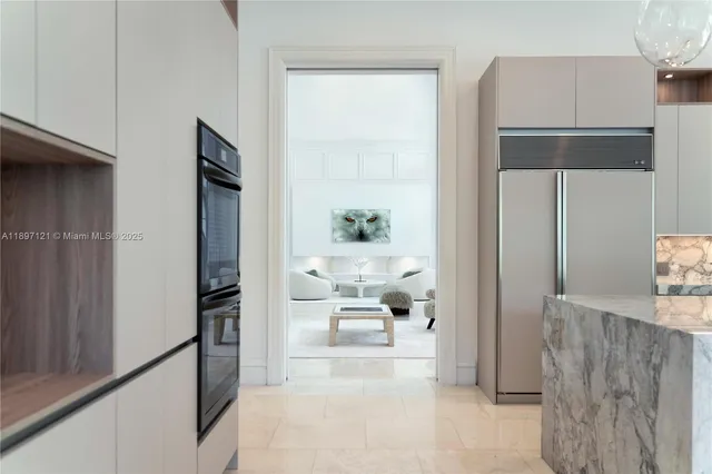 a view of a hallway with living room