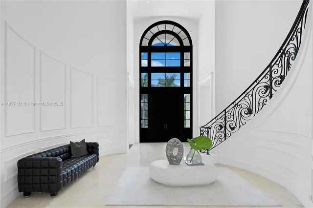 a view of hall way with furniture and entryway