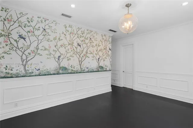 a view of wooden floor and chandelier in a room