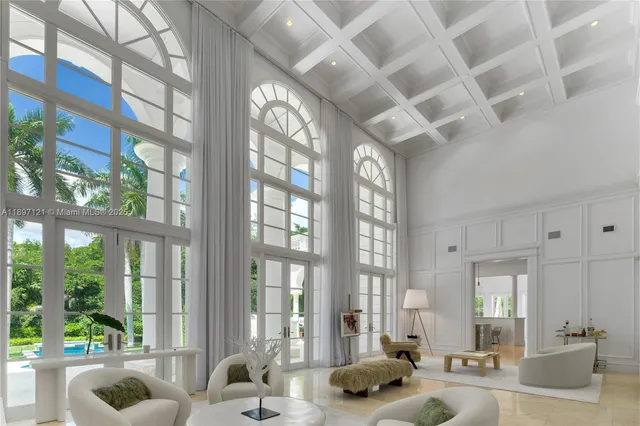 a large room with lots of furniture and windows