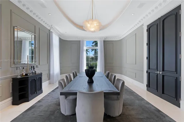 a view of a dining room with furniture and window