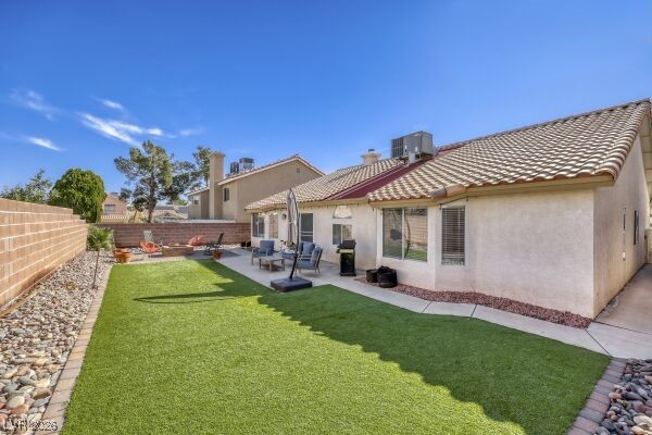 1536 Pony Ranch Circle Henderson, NV 89014 - Photo 23 of 24 Huge backyard with fire pit and artificial turf.