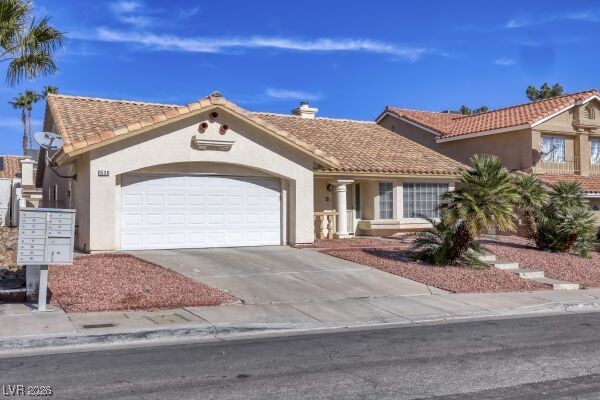 1536 Pony Ranch Circle Henderson, NV 89014 - Photo 3 of 24 Mediterranean / spanish house featuring stucco siding, a garage, driveway, and a tile roof