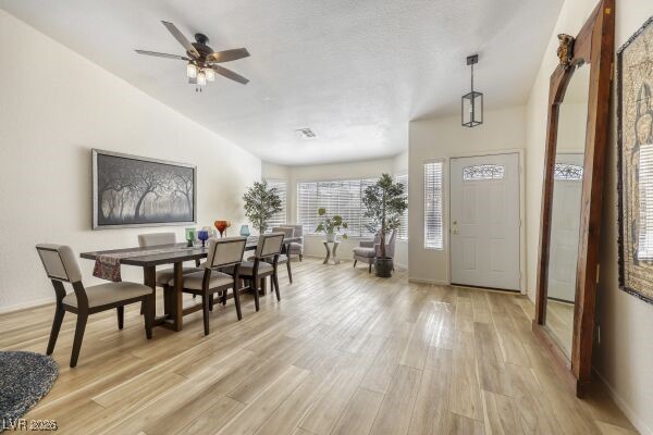 1536 Pony Ranch Circle Henderson, NV 89014 - Photo 5 of 24 Entrance foyer featuring light wood-type flooring, lofted ceiling, and a ceiling fan