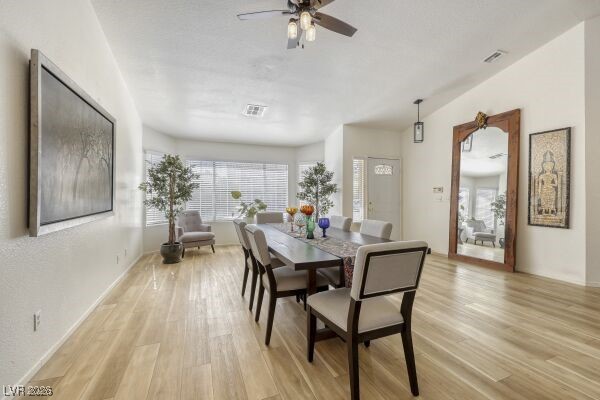 1536 Pony Ranch Circle Henderson, NV 89014 - Photo 6 of 24 Dining area featuring light wood-style flooring and ceiling fan