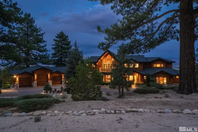 a view of a house with a yard and tree s