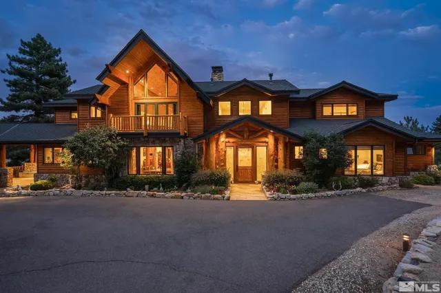 a view of a hallway with entryway wooden floor and front door