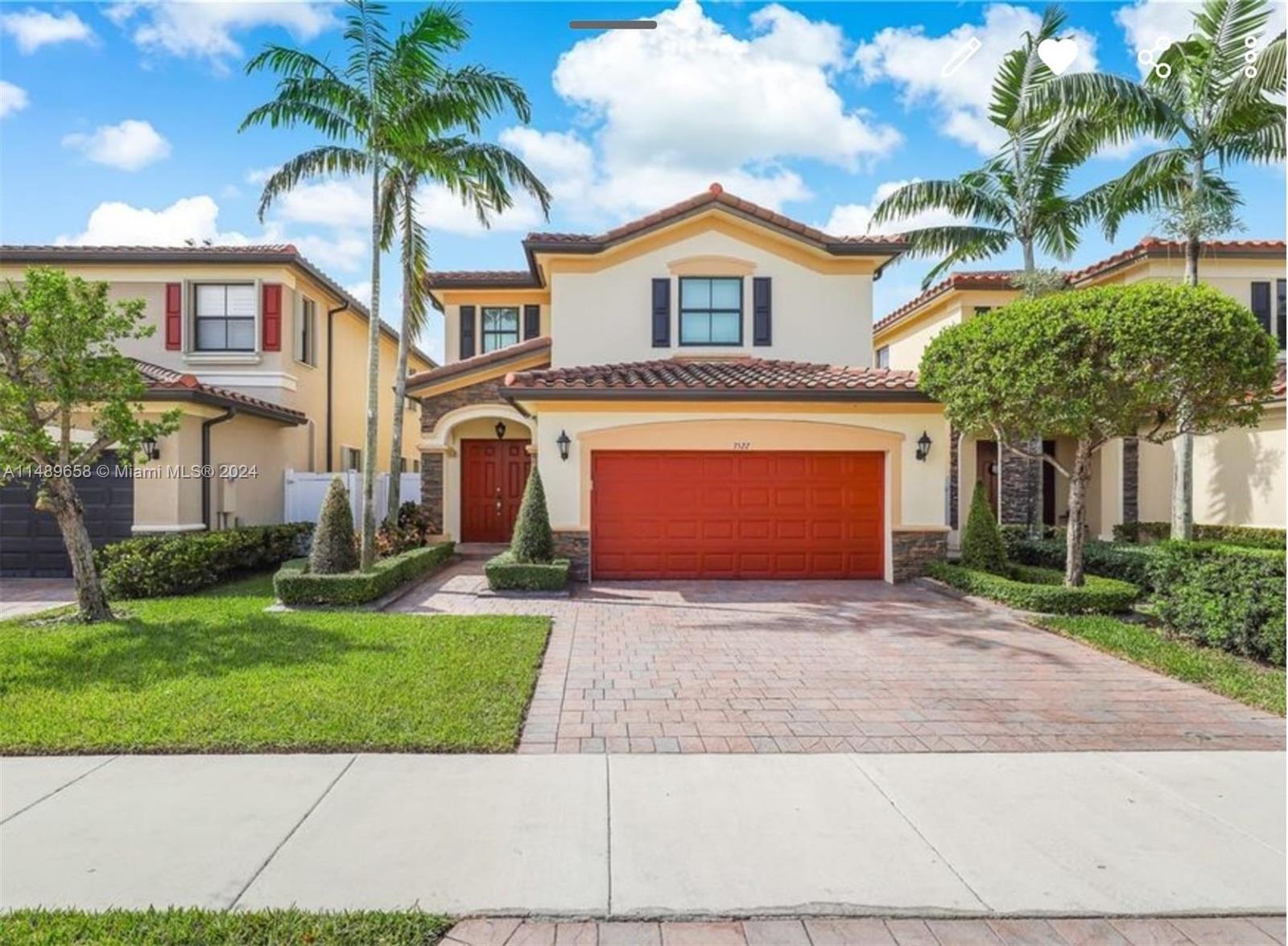 3522 West 88th Street Hialeah, FL 33018 - Photo 1 of 52 a front view of a house with a garden and plants