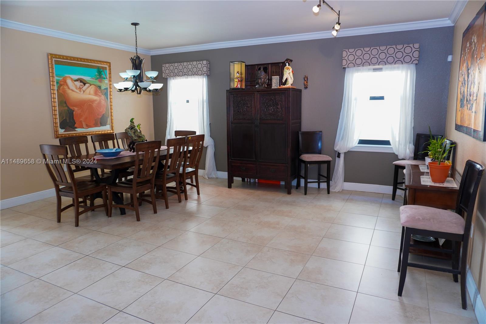 3522 West 88th Street Hialeah, FL 33018 - Photo 11 of 52 a view of a dining room with furniture