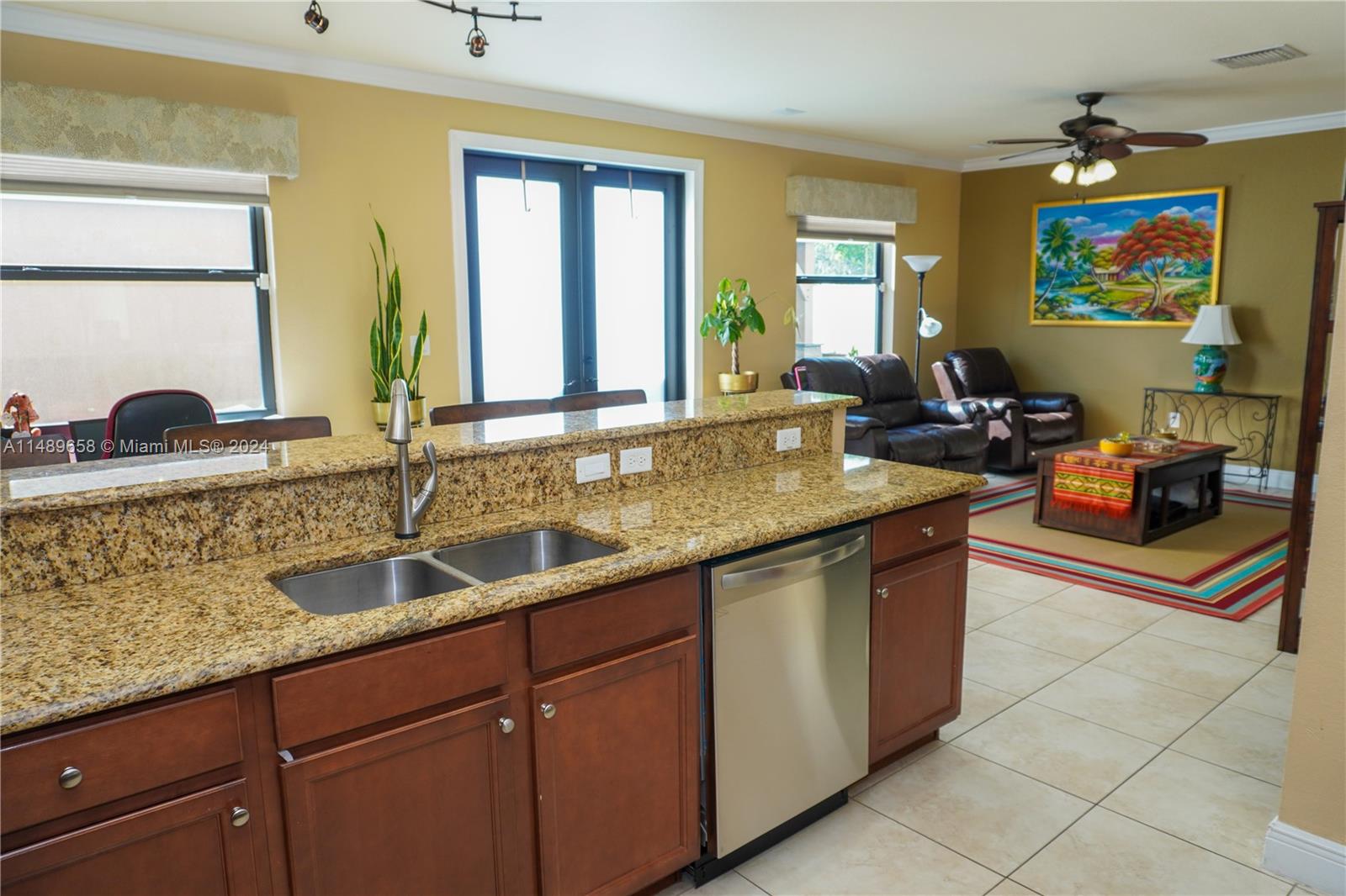 3522 West 88th Street Hialeah, FL 33018 - Photo 15 of 52 a kitchen with stainless steel appliances granite countertop a sink stove and cabinets