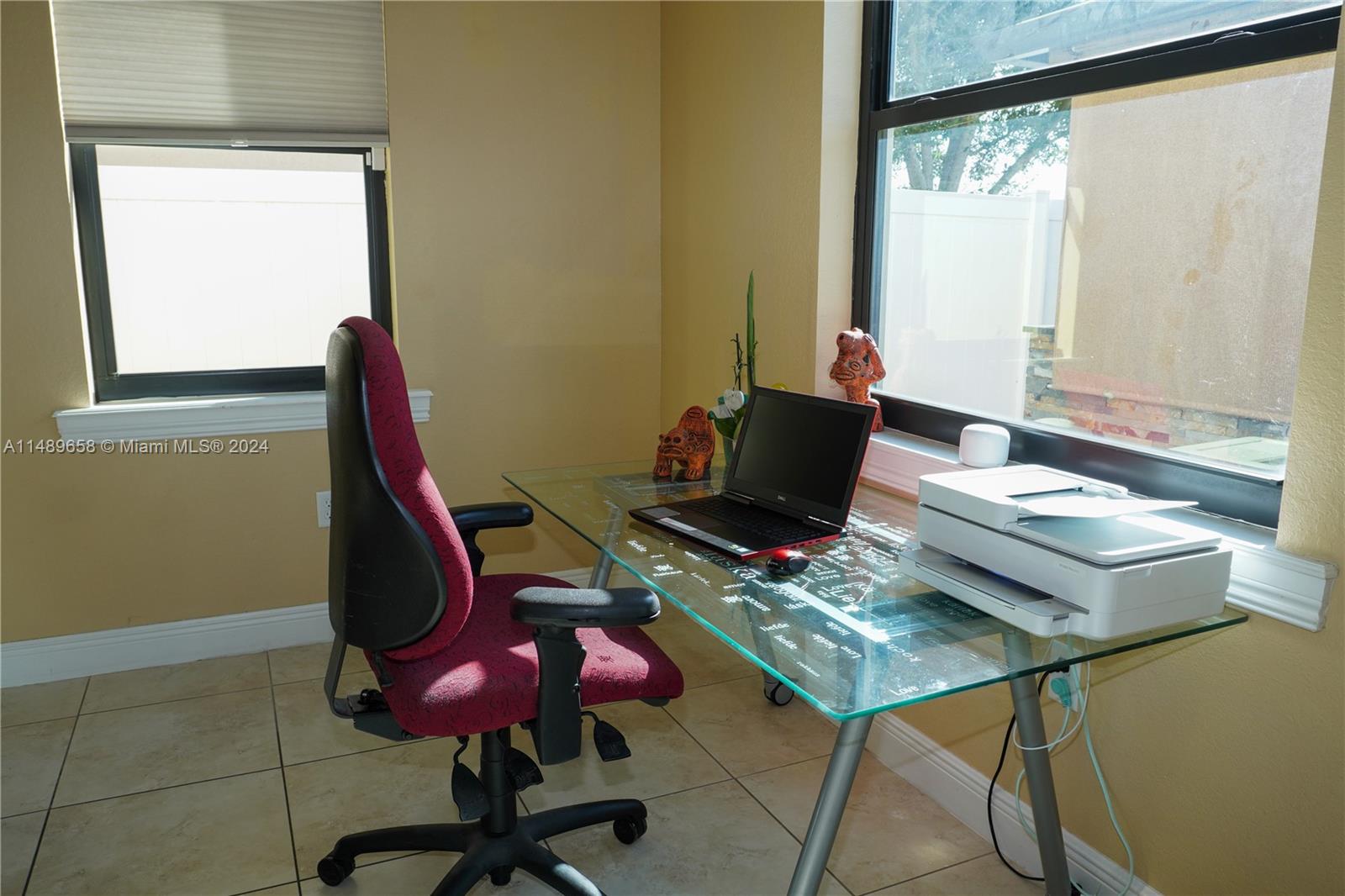 3522 West 88th Street Hialeah, FL 33018 - Photo 16 of 52 a workspace with furniture and a window