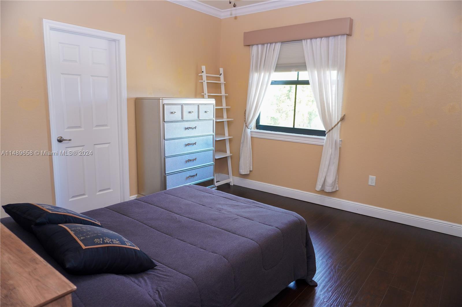 3522 West 88th Street Hialeah, FL 33018 - Photo 22 of 52 a bedroom with a bed and a window