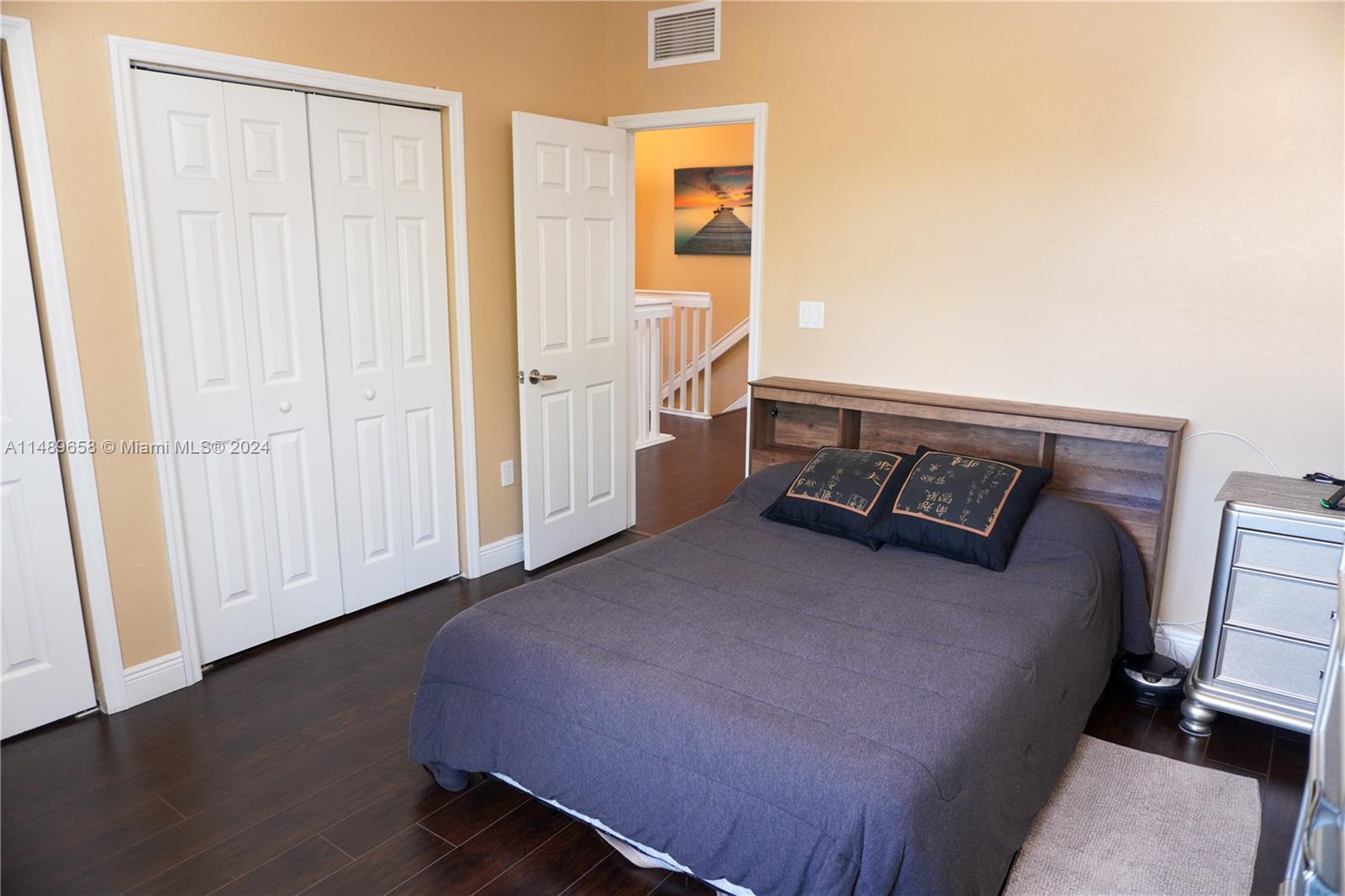 3522 West 88th Street Hialeah, FL 33018 - Photo 24 of 52 a bed room with a bed and a window