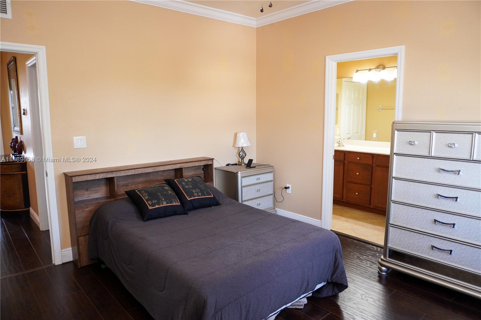 3522 West 88th Street Hialeah, FL 33018 - Photo 25 of 52 a bedroom with a bed and a dresser