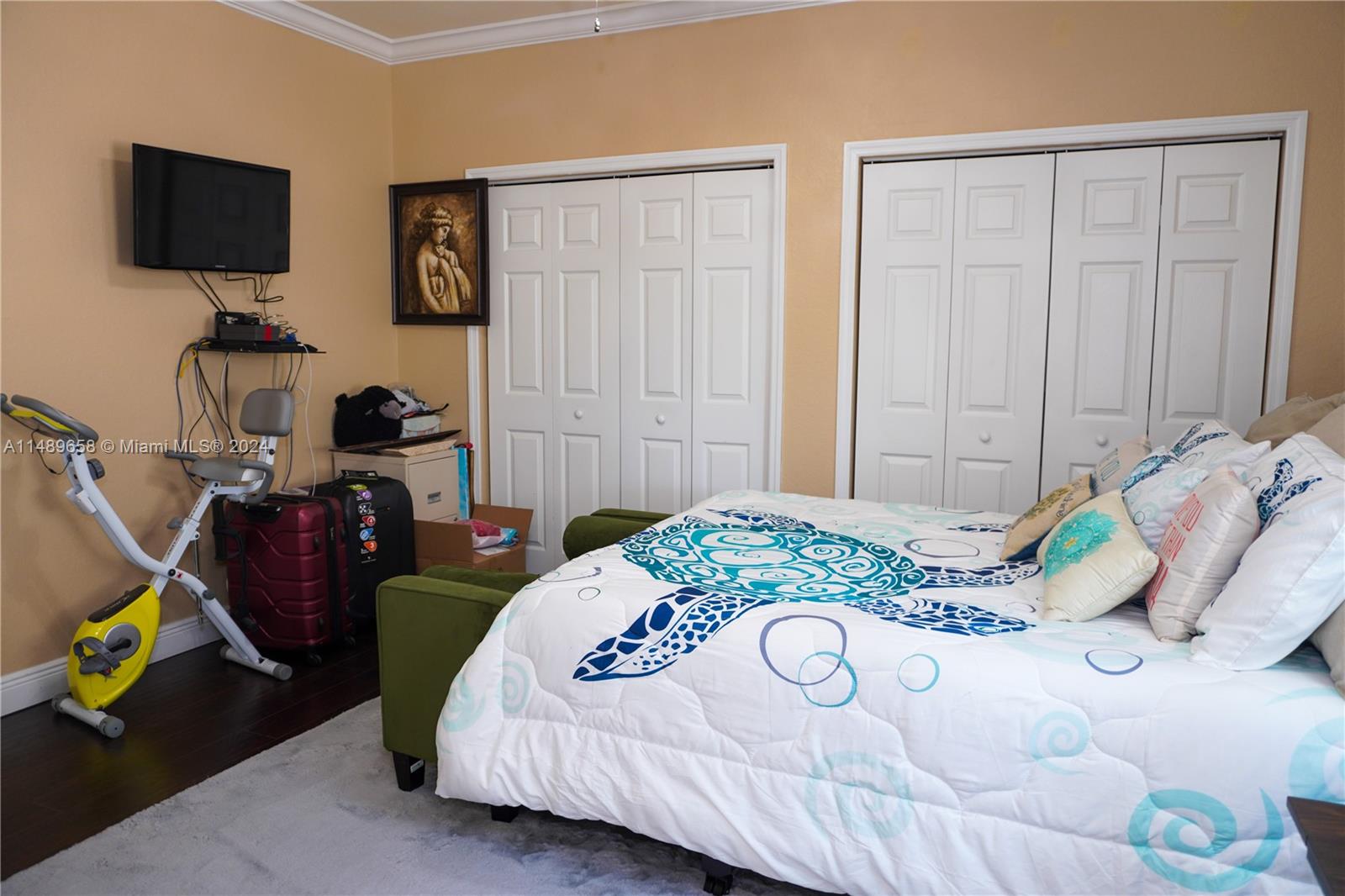 3522 West 88th Street Hialeah, FL 33018 - Photo 26 of 52 a bedroom with bed and a flat screen tv