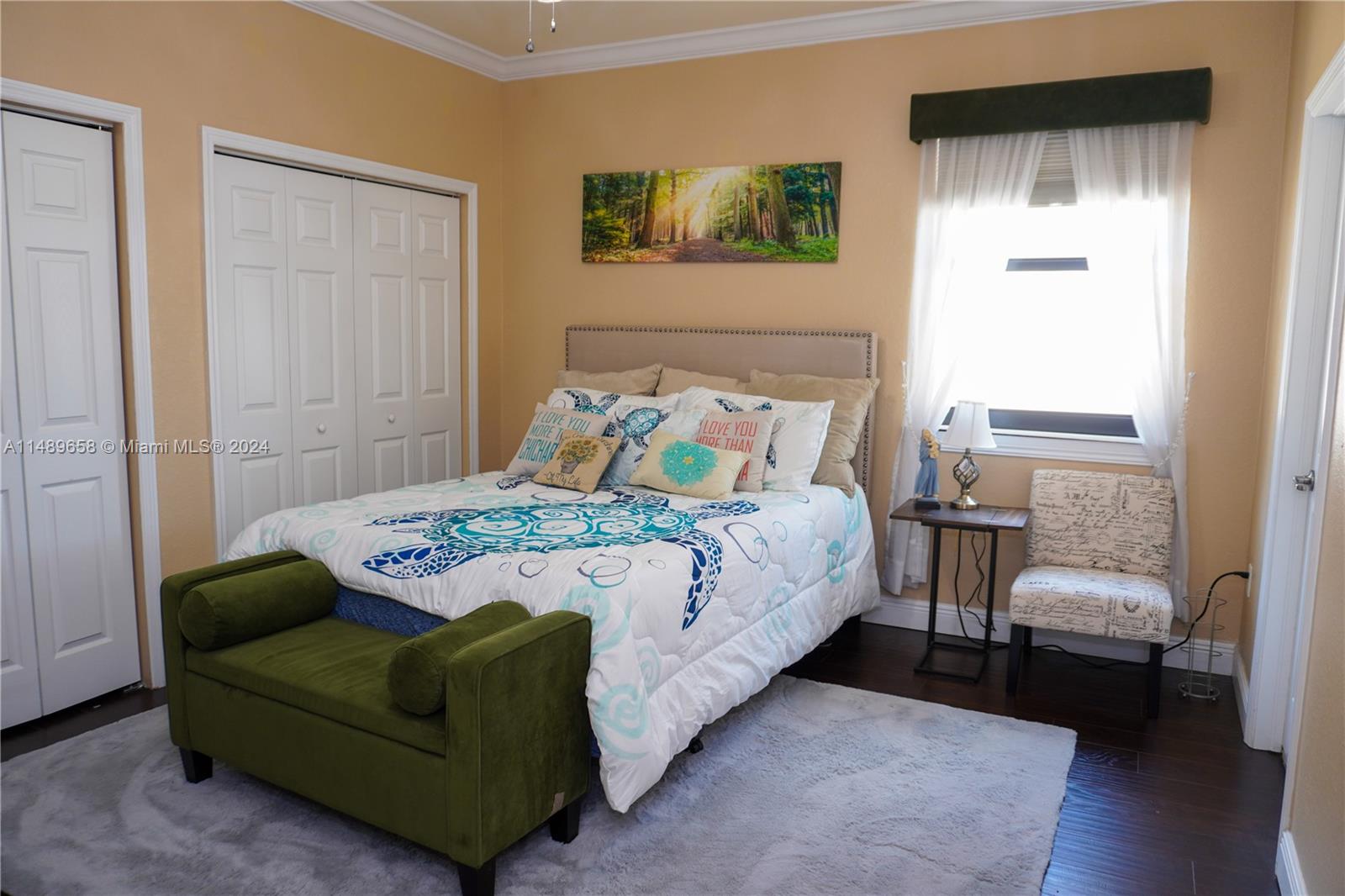 3522 West 88th Street Hialeah, FL 33018 - Photo 27 of 52 a bedroom with a bed and a couch