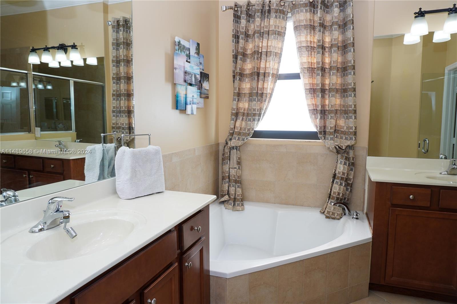 3522 West 88th Street Hialeah, FL 33018 - Photo 33 of 52 a bathroom with a sink and a mirror