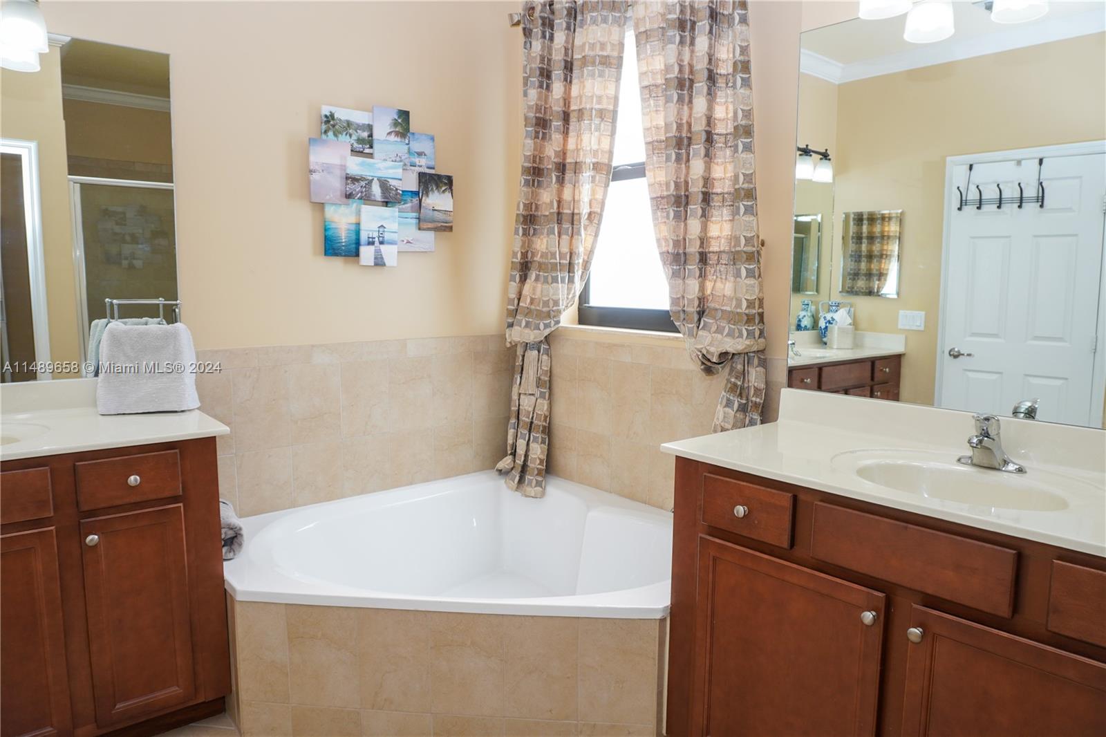 3522 West 88th Street Hialeah, FL 33018 - Photo 34 of 52 a bathroom with a sink and a bathtub