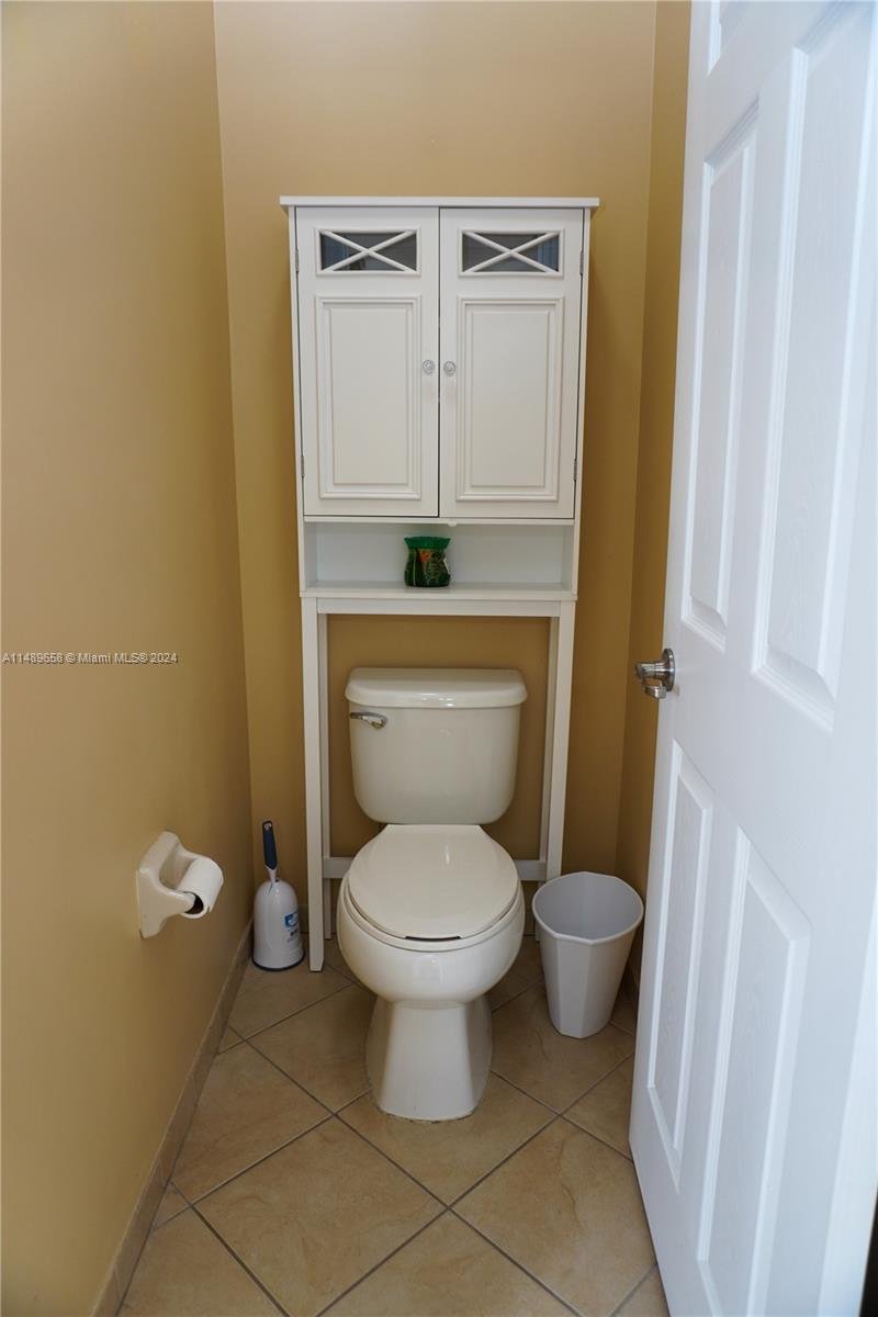 3522 West 88th Street Hialeah, FL 33018 - Photo 37 of 52 a bathroom with a toilet and a sink