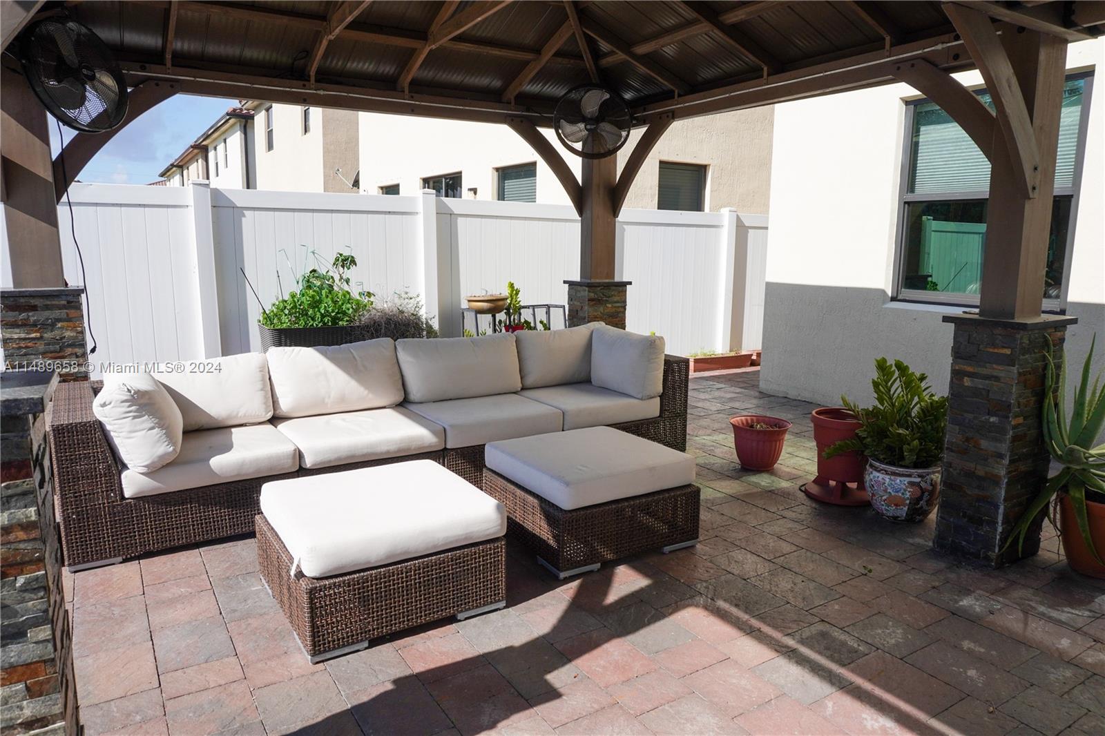 3522 West 88th Street Hialeah, FL 33018 - Photo 45 of 52 a outdoor living space with furniture and garden