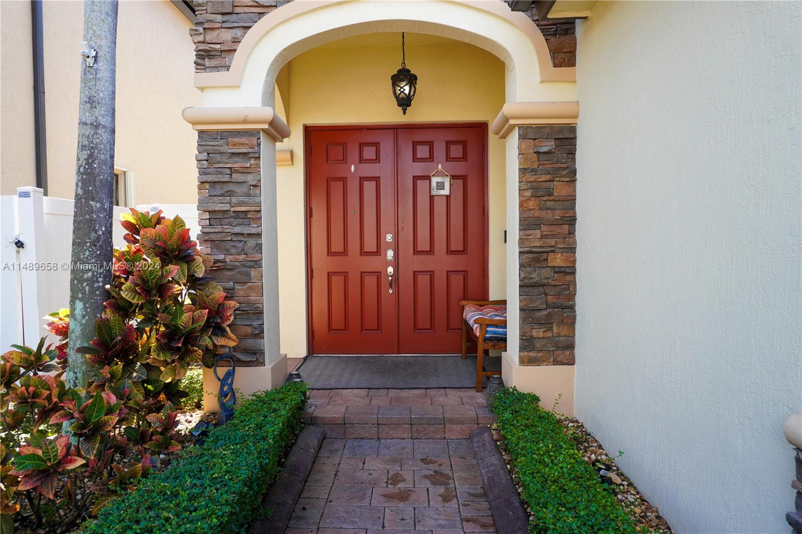 3522 West 88th Street Hialeah, FL 33018 - Photo 5 of 52 a front view of a house with a garden