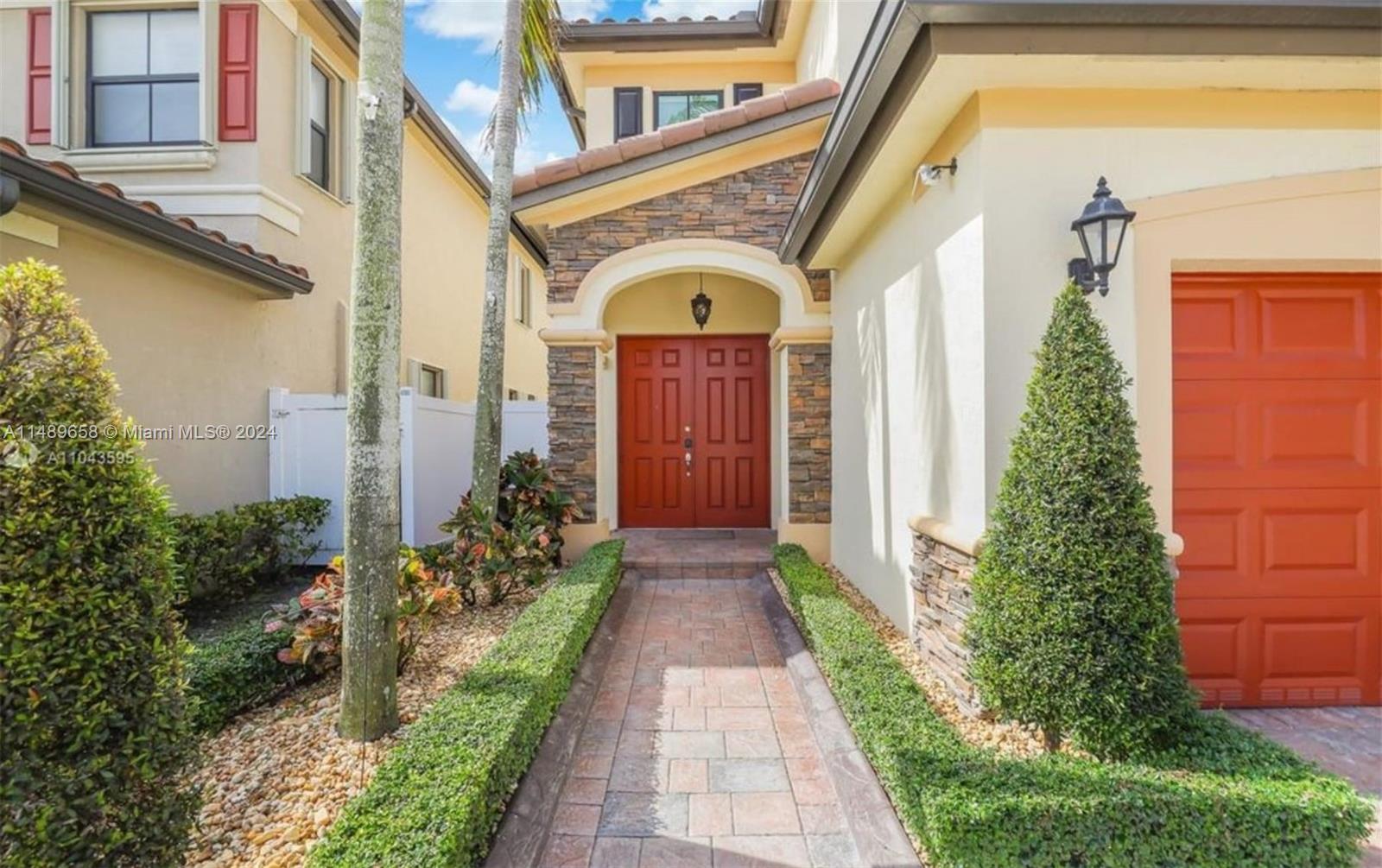 3522 West 88th Street Hialeah, FL 33018 - Photo 6 of 52 a view of entrance of the house and trees