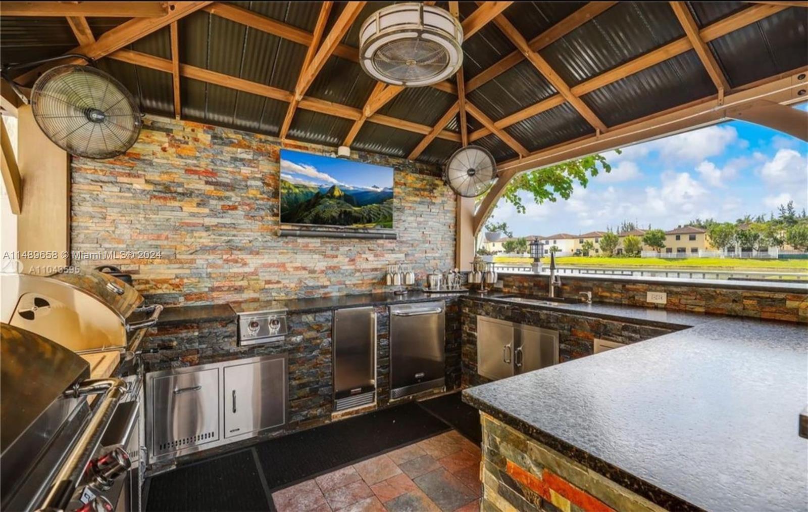 3522 West 88th Street Hialeah, FL 33018 - Photo 10 of 52 a view of a kitchen with a wooden floor and a sink