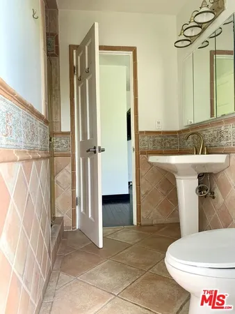 a bathroom with a sink and toilet