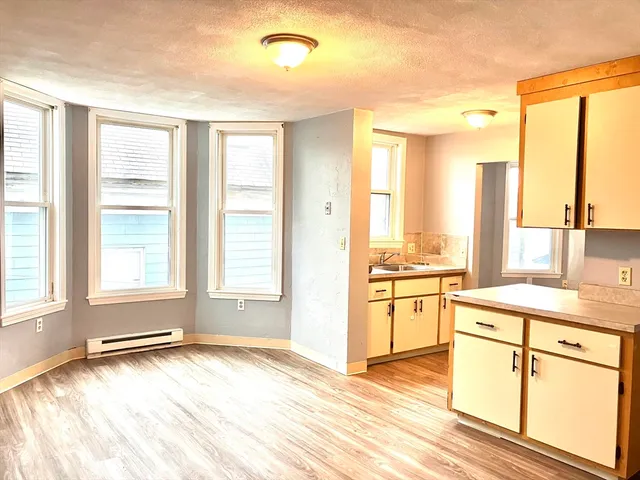 a view of a kitchen with a sink