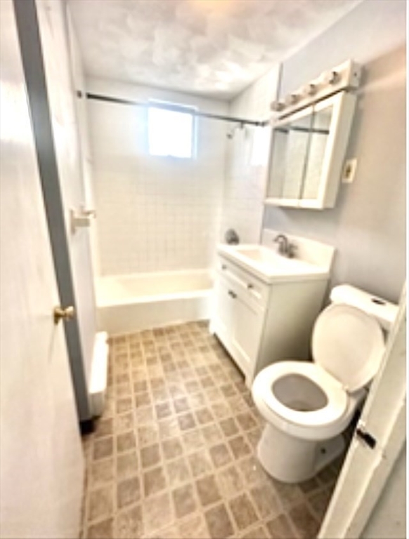 57 Rogers Avenue, Unit 2 Lynn, MA 01902 - Photo 6 of 9 a bathroom with a toilet and a shower