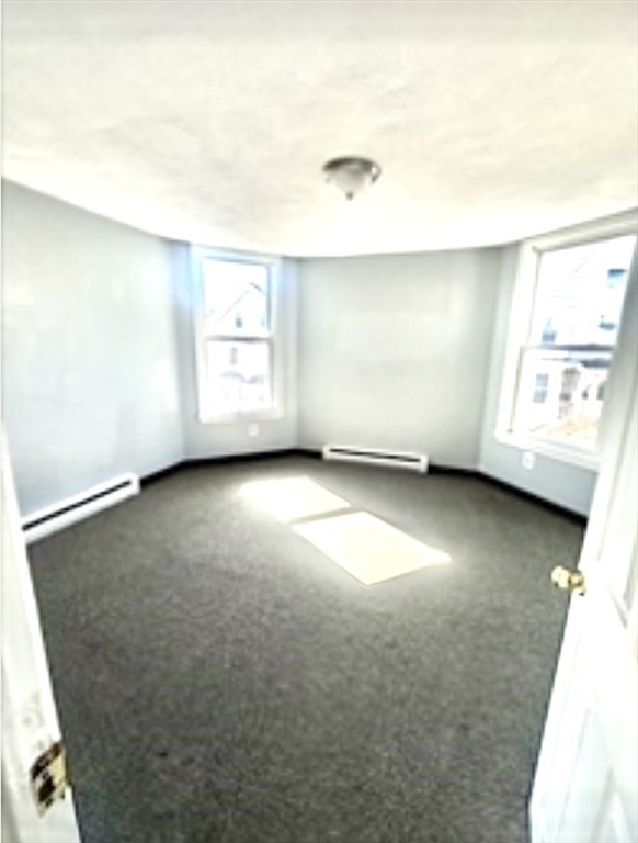 57 Rogers Avenue, Unit 2 Lynn, MA 01902 - Photo 9 of 9 an empty room with a window