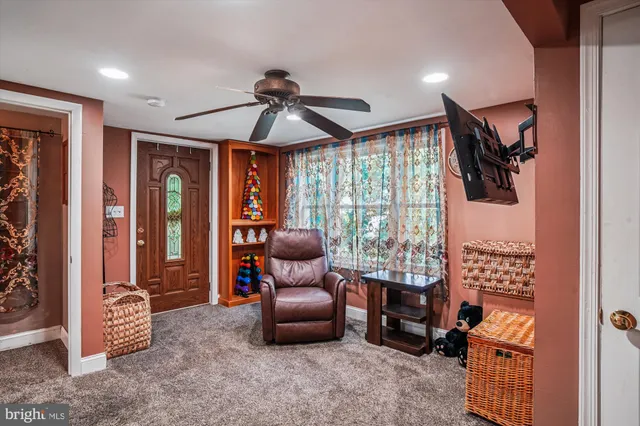 a bedroom with furniture and a window