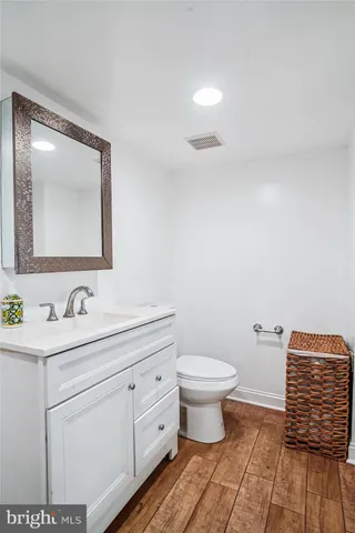 a bedroom with a bed and a large mirror