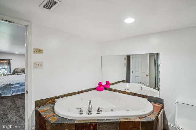 a bedroom with furniture and a baby bed