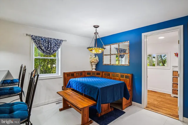 a bedroom with a bed and a dresser in it