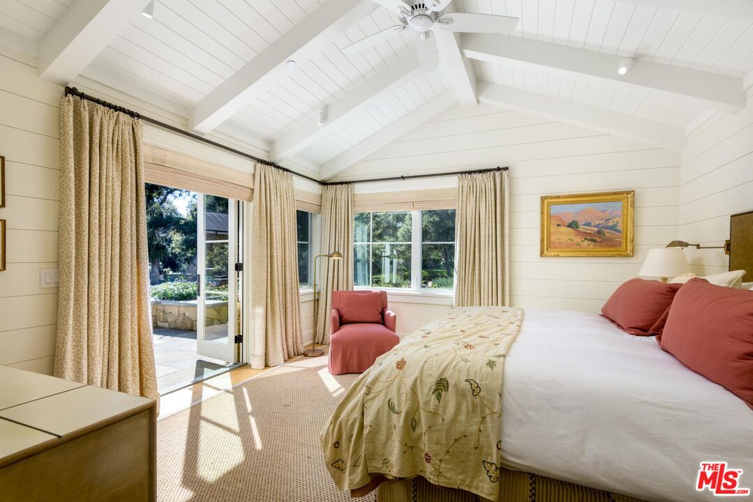 1779 Glen Oaks Drive Montecito, CA 93108 - Photo 11 of 32 a bedroom with a bed and glass window