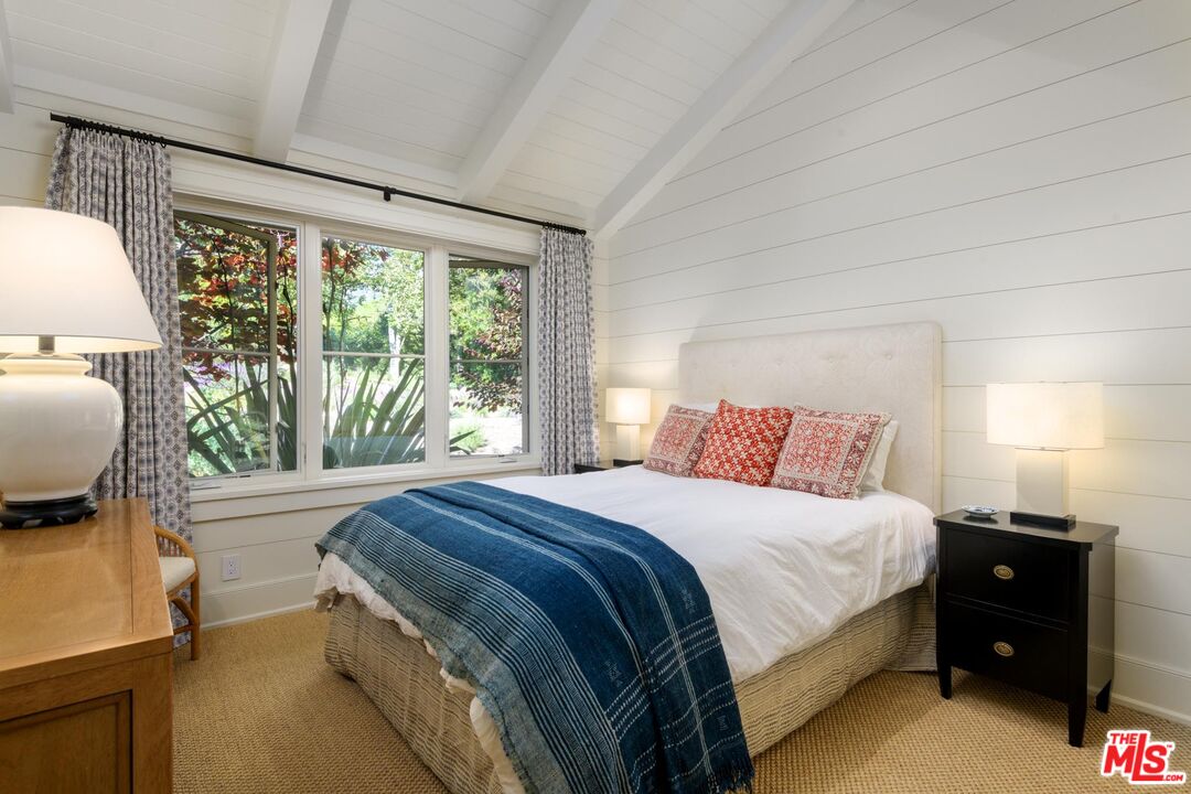 1779 Glen Oaks Drive Montecito, CA 93108 - Photo 14 of 32 a bedroom with a bed and a large window