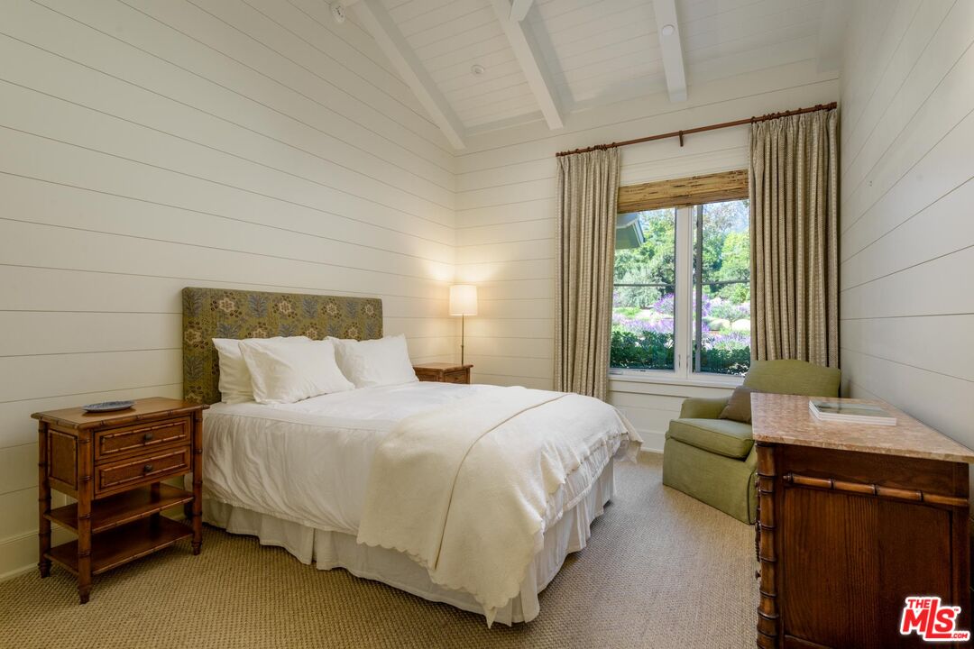 1779 Glen Oaks Drive Montecito, CA 93108 - Photo 16 of 32 a bedroom with a bed and a window
