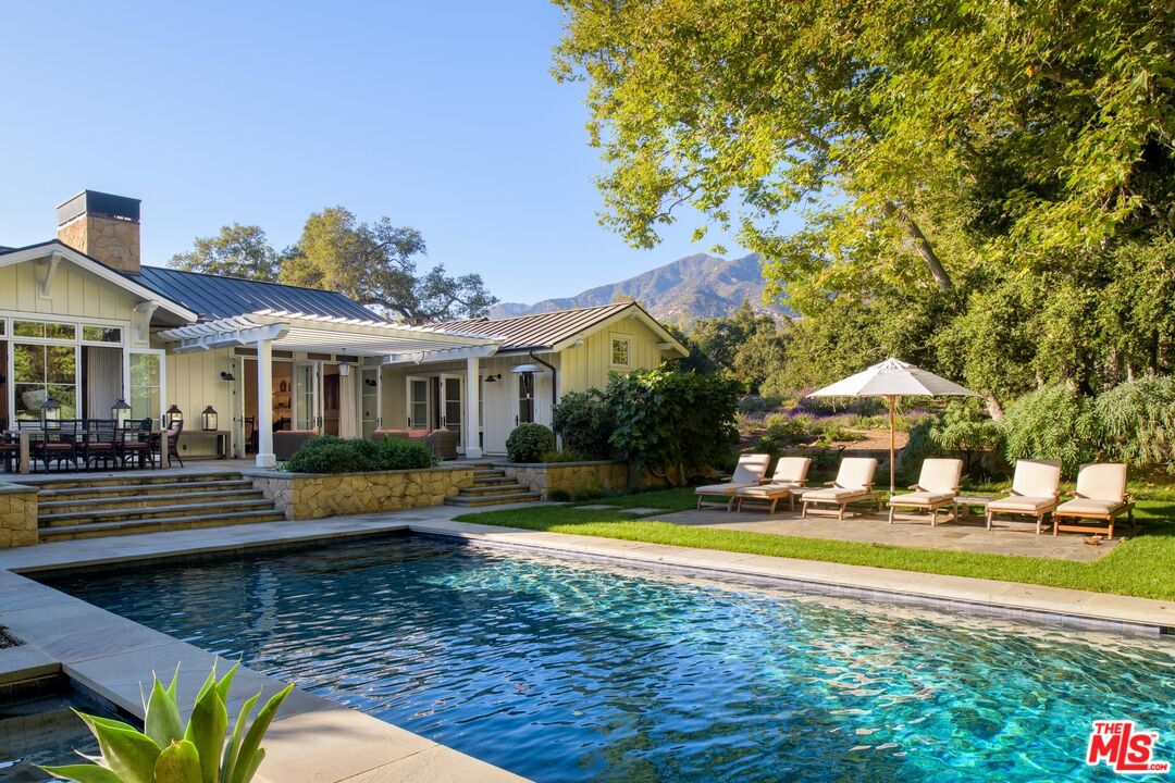 1779 Glen Oaks Drive Montecito, CA 93108 - Photo 18 of 32 a view of a house with swimming pool and sitting area