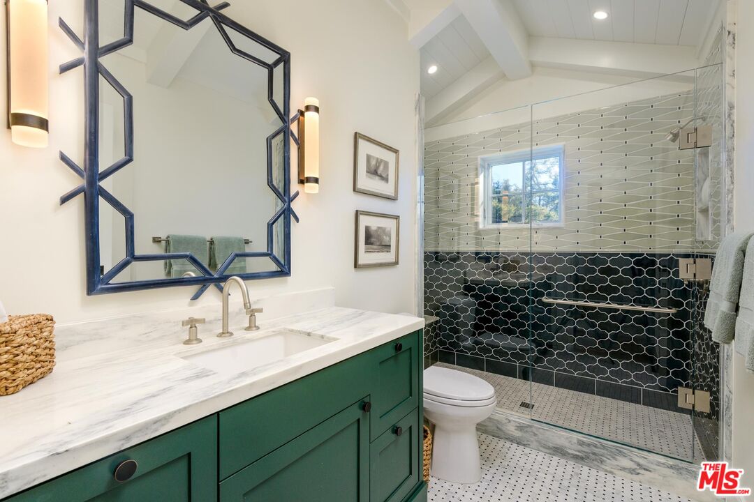 1779 Glen Oaks Drive Montecito, CA 93108 - Photo 27 of 32 a bathroom with a granite countertop sink toilet and shower