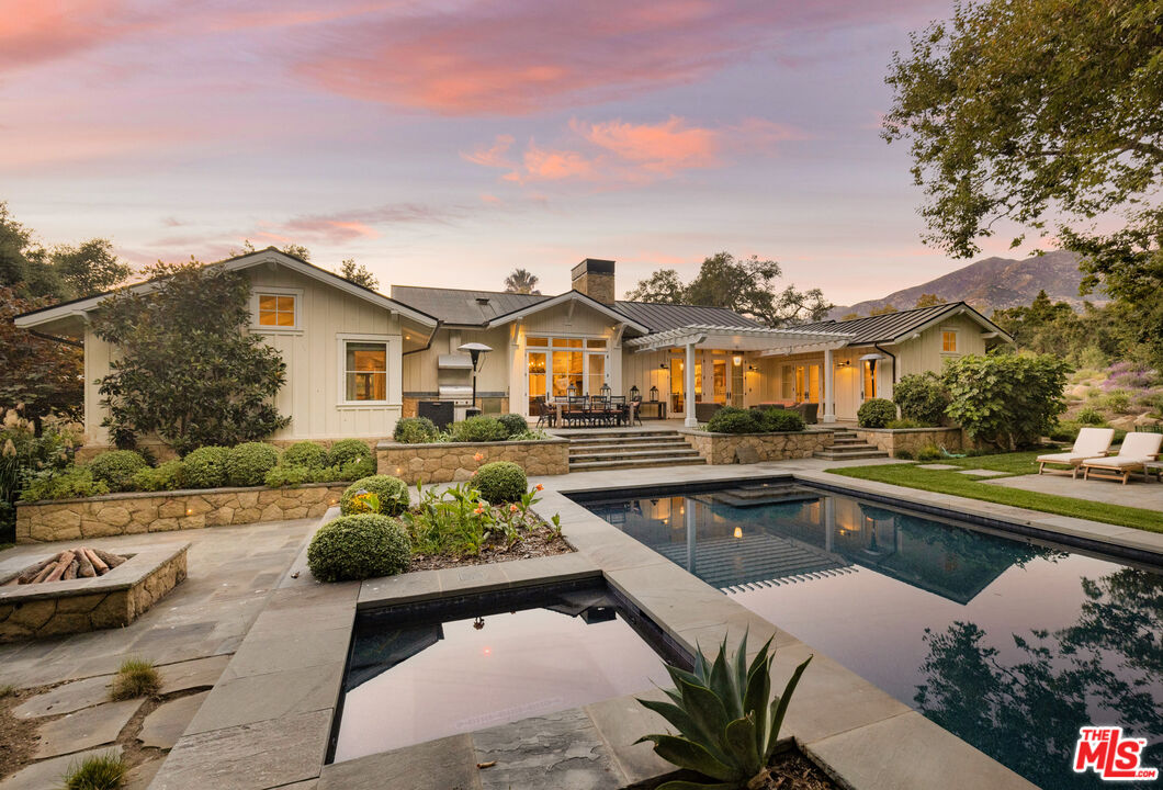 1779 Glen Oaks Drive Montecito, CA 93108 - Photo 5 of 32 a view of a swimming pool with a lounge chair