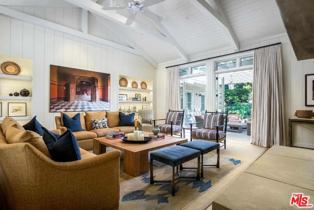 1779 Glen Oaks Drive Montecito, CA 93108 - Photo 6 of 32 a living room with furniture large window and wooden floor