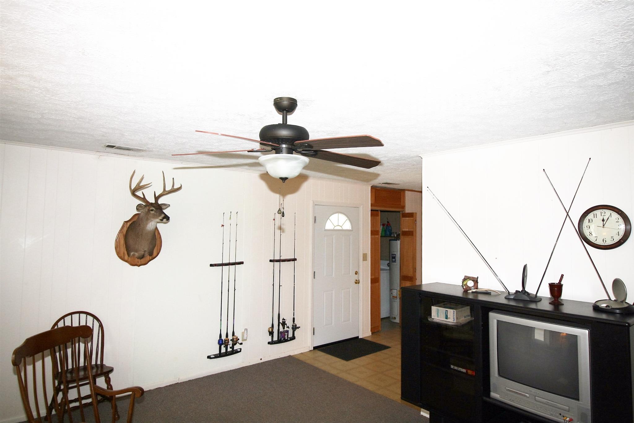 17550 Witty Mill Road Elkmont, AL 35620 - Photo 5 of 27 a view of a chandelier fan and wooden floor